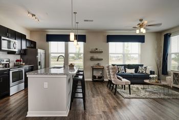 An open floor plan with a kitchen and living room